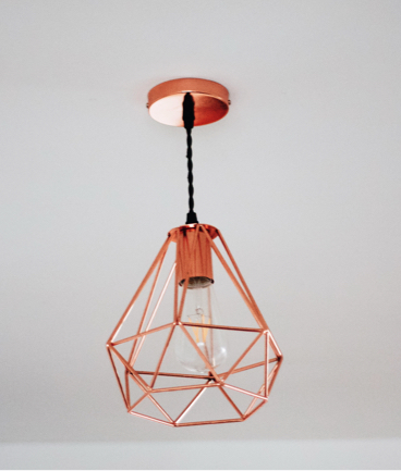 photo of a geometrically shaped lamp hanging from the ceiling